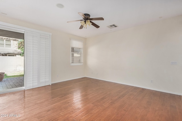 spare room with light hardwood / wood-style floors and ceiling fan