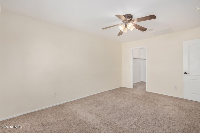 unfurnished room featuring light carpet