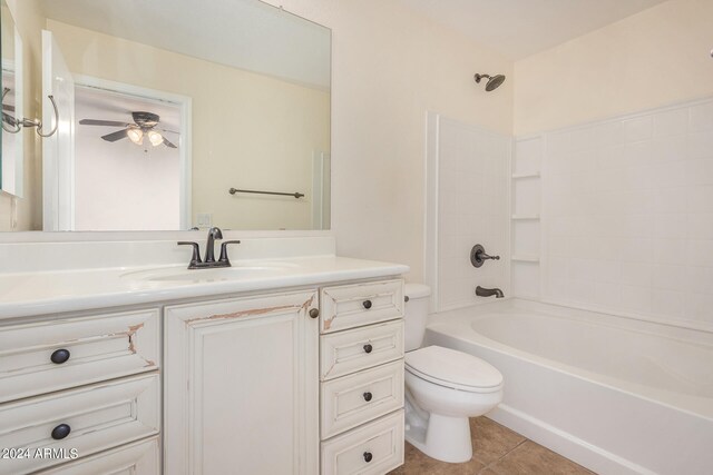 full bathroom with ceiling fan, toilet, shower / bath combination, vanity, and tile patterned flooring