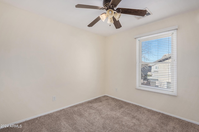 unfurnished room with carpet flooring