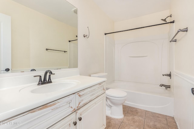 full bathroom featuring vanity, toilet, tile patterned flooring, and tub / shower combination