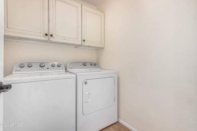 laundry area with cabinets and separate washer and dryer