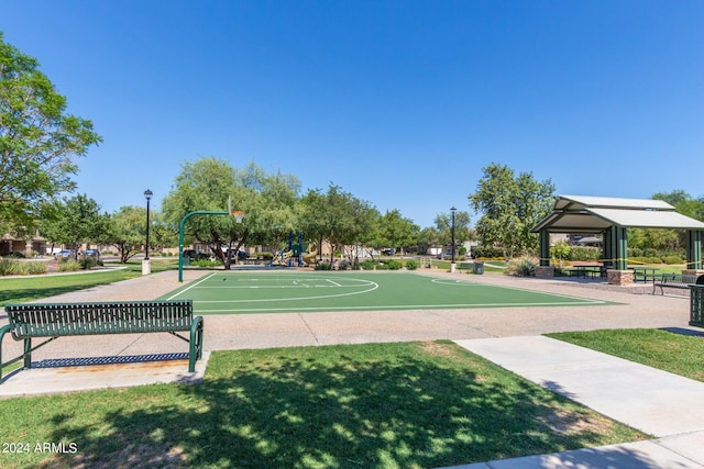 view of basketball court with a gazebo and a lawn