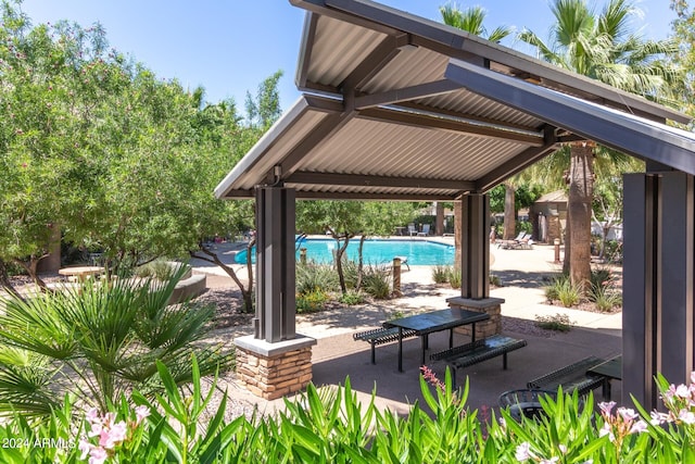 view of community featuring a gazebo, a patio area, and a pool