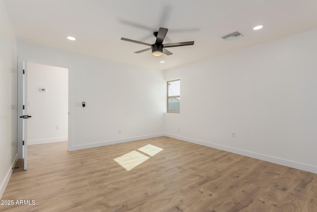 unfurnished room featuring ceiling fan and light hardwood / wood-style floors