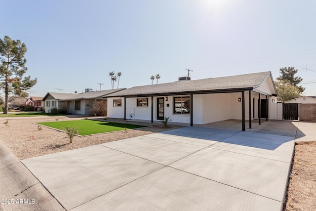 single story home featuring a front yard