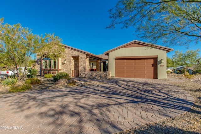 3675 Gold Ridge Rd, Wickenburg, AZ 85390 - single story home with a garage, decorative driveway, stucco siding, and stone siding