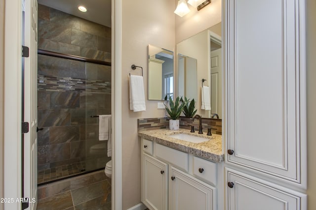 3675 Gold Ridge Rd, Wickenburg, AZ 85390 - bathroom featuring toilet, vanity, a stall shower, and recessed lighting