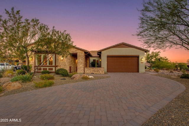 3675 Gold Ridge Rd, Wickenburg, AZ 85390 - ranch-style home with decorative driveway, an attached garage, stucco siding, and stone siding