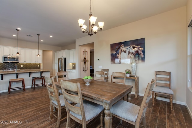 3675 Gold Ridge Rd, Wickenburg, AZ 85390 - dining area with dark wood-style flooring, recessed lighting, a chandelier, and baseboards