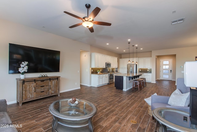 3675 Gold Ridge Rd, Wickenburg, AZ 85390 - living area featuring dark wood-style flooring, a ceiling fan, baseboards, and recessed lighting