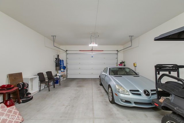 3675 Gold Ridge Rd, Wickenburg, AZ 85390 - garage with a garage door opener and a central vacuum unit