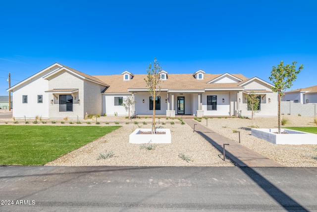 view of front of home with a front yard