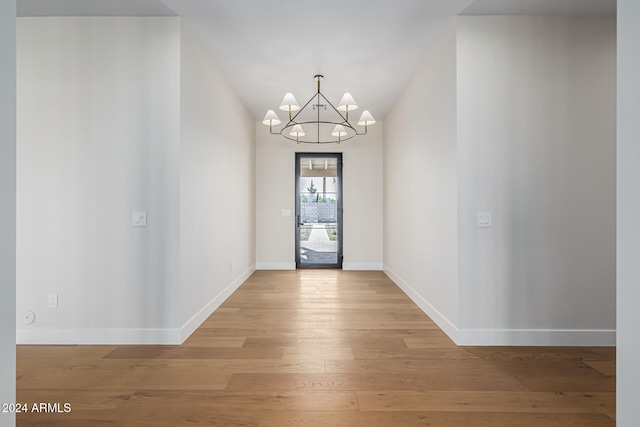 entryway featuring a chandelier and light wood-type flooring