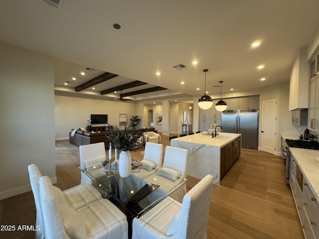 dining area featuring recessed lighting, baseboards, visible vents, and light wood-style flooring
