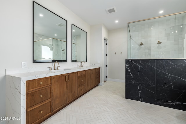 bathroom with vanity, parquet floors, and tiled shower