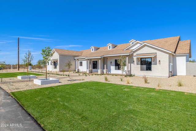 ranch-style home featuring a front yard