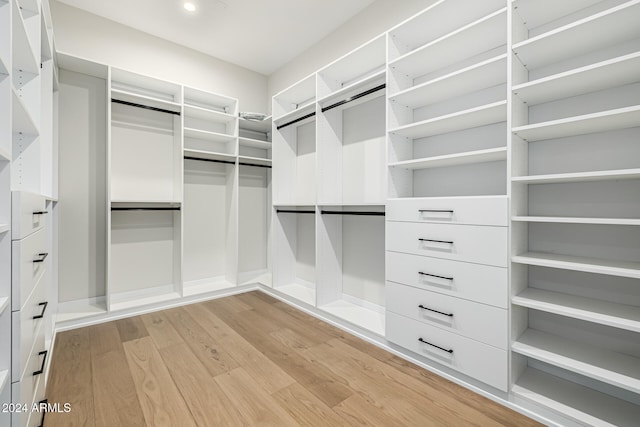 spacious closet featuring light hardwood / wood-style floors