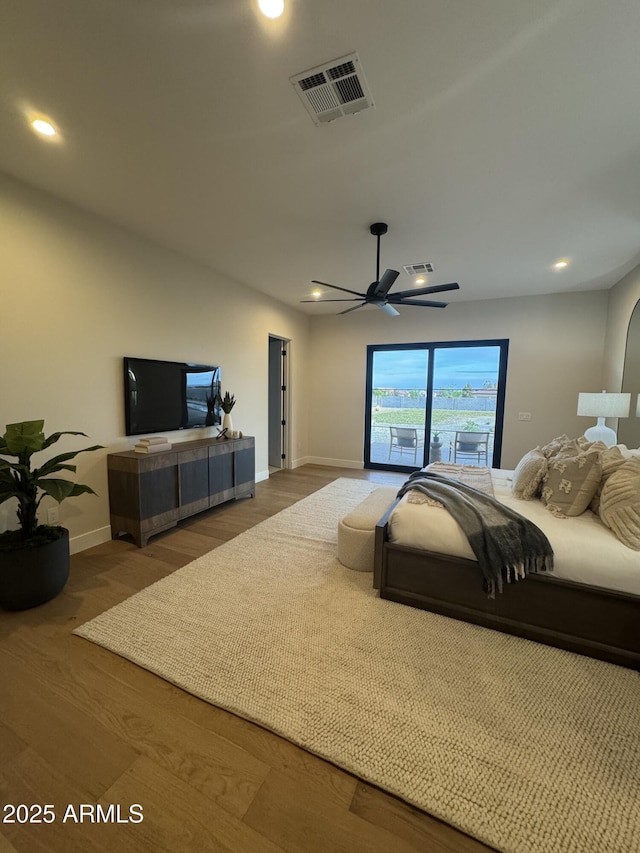 bedroom featuring recessed lighting, baseboards, visible vents, and wood finished floors