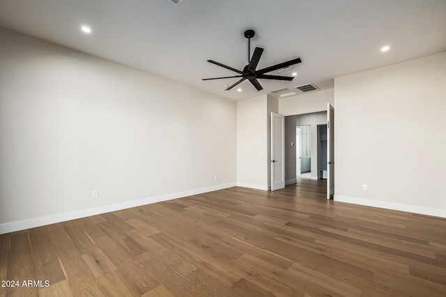 spare room with a ceiling fan, visible vents, wood finished floors, and recessed lighting
