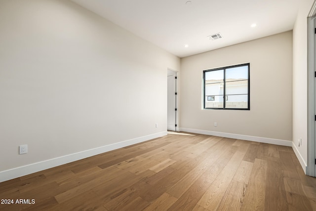 spare room featuring light wood-type flooring