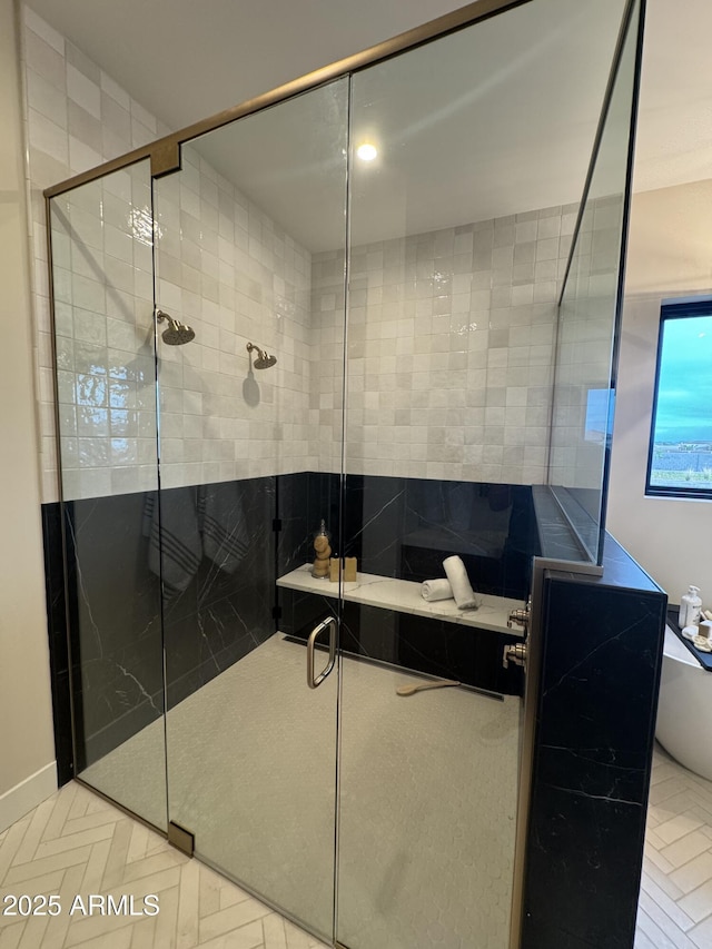 full bathroom featuring a stall shower and a tub
