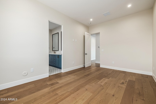 spare room featuring light hardwood / wood-style floors