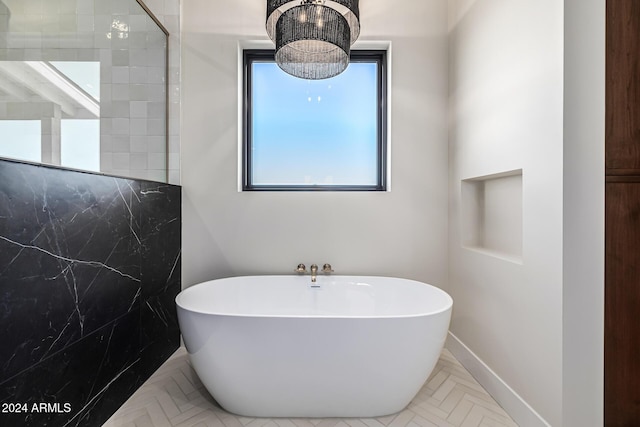 bathroom with a freestanding bath and tiled shower