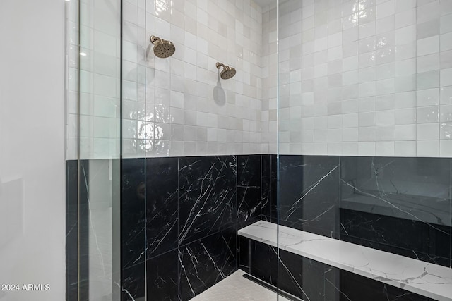 bathroom with a tile shower