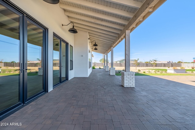 view of patio featuring ceiling fan