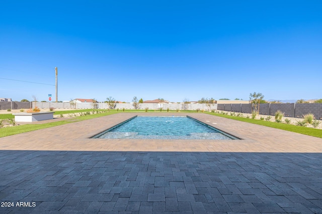 view of pool with a fenced in pool, fence, and a patio