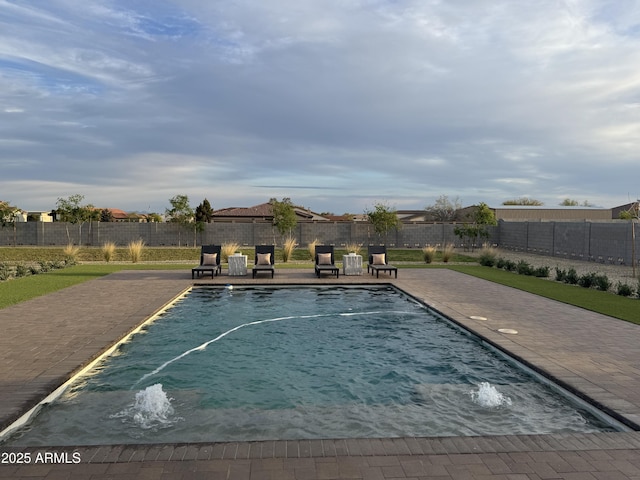 view of pool with a patio, a fenced in pool, and a fenced backyard