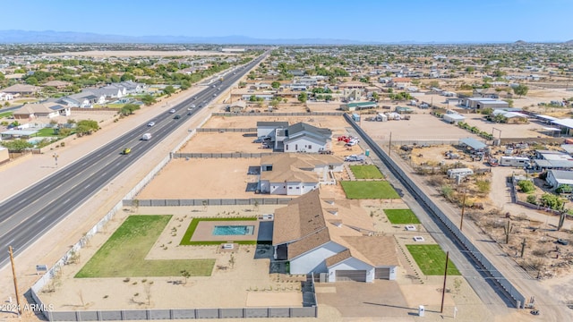 drone / aerial view featuring a residential view and a mountain view