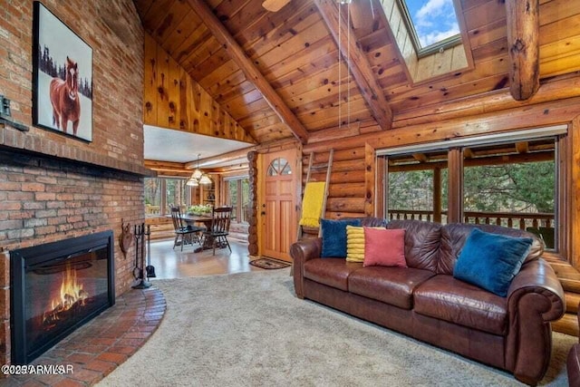 living area with wood ceiling, log walls, a skylight, and beamed ceiling