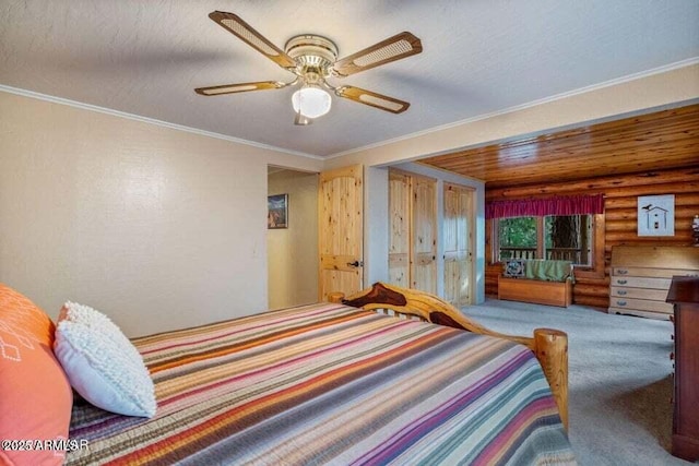 carpeted bedroom with a ceiling fan and rustic walls