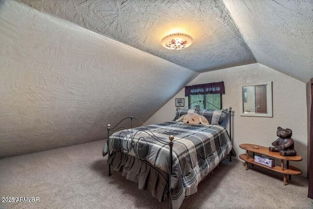 carpeted bedroom featuring vaulted ceiling and a textured ceiling
