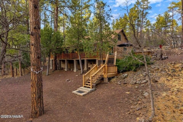 view of jungle gym with stairs and a deck