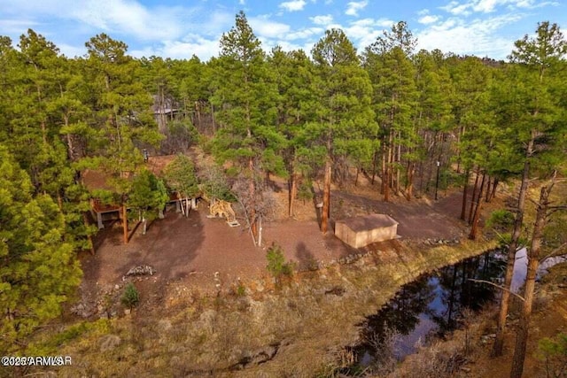 aerial view featuring a forest view