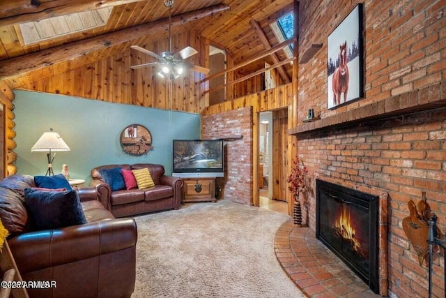 carpeted living area with beam ceiling, wood ceiling, a brick fireplace, high vaulted ceiling, and ceiling fan