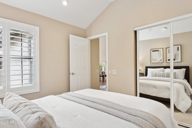 bedroom featuring lofted ceiling