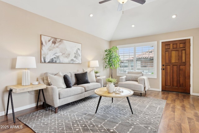 living area with wood finished floors, vaulted ceiling, baseboards, a ceiling fan, and recessed lighting