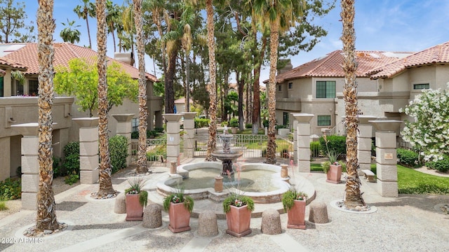 view of home's community featuring a residential view and fence