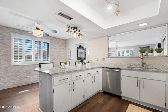 9621 E Calgary Ave, Sun Lakes, AZ 85248 - kitchen featuring stainless steel dishwasher, a sink, ceiling fan, a peninsula, and dark wood-type flooring