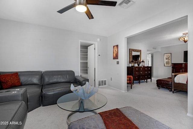 9621 E Calgary Ave, Sun Lakes, AZ 85248 - living area featuring carpet flooring, a ceiling fan, and baseboards