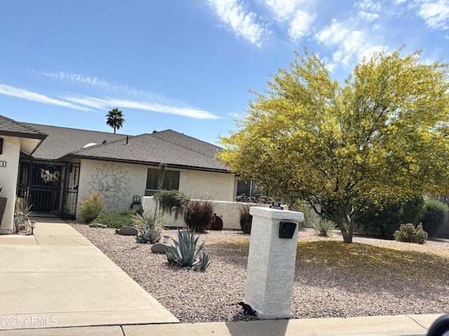 9621 E Calgary Ave, Sun Lakes, AZ 85248 - ranch-style home featuring a shingled roof, a gate, and fence
