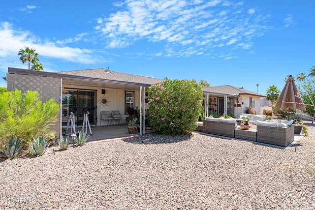 9621 E Calgary Ave, Sun Lakes, AZ 85248 - back of house with an outdoor hangout area and a patio area