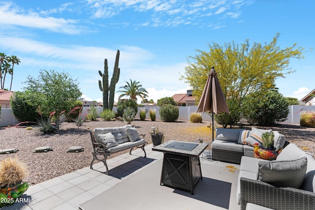 9621 E Calgary Ave, Sun Lakes, AZ 85248 - view of patio with an outdoor living space with a fire pit and a fenced backyard