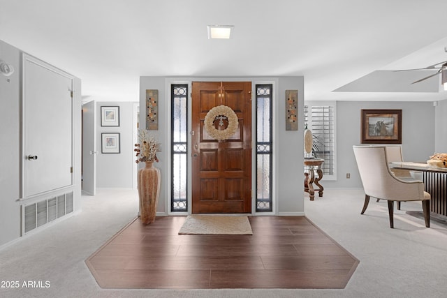 9621 E Calgary Ave, Sun Lakes, AZ 85248 - carpeted entrance foyer with baseboards, a ceiling fan, and wood finished floors