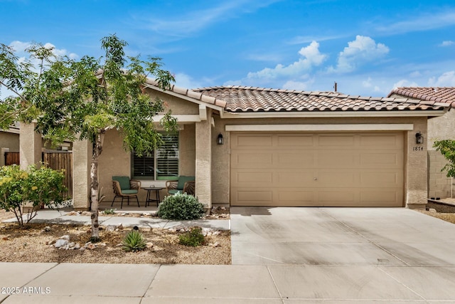 1874 E Mesquite Ave, Apache Junction, AZ 85119 - view of front of house with concrete driveway, an attached garage, stucco siding, a tile roof, and a porch