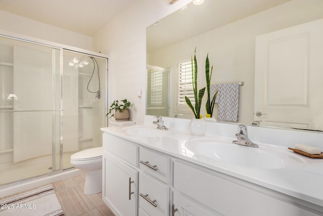 1874 E Mesquite Ave, Apache Junction, AZ 85119 - bathroom featuring double vanity, a shower stall, and toilet
